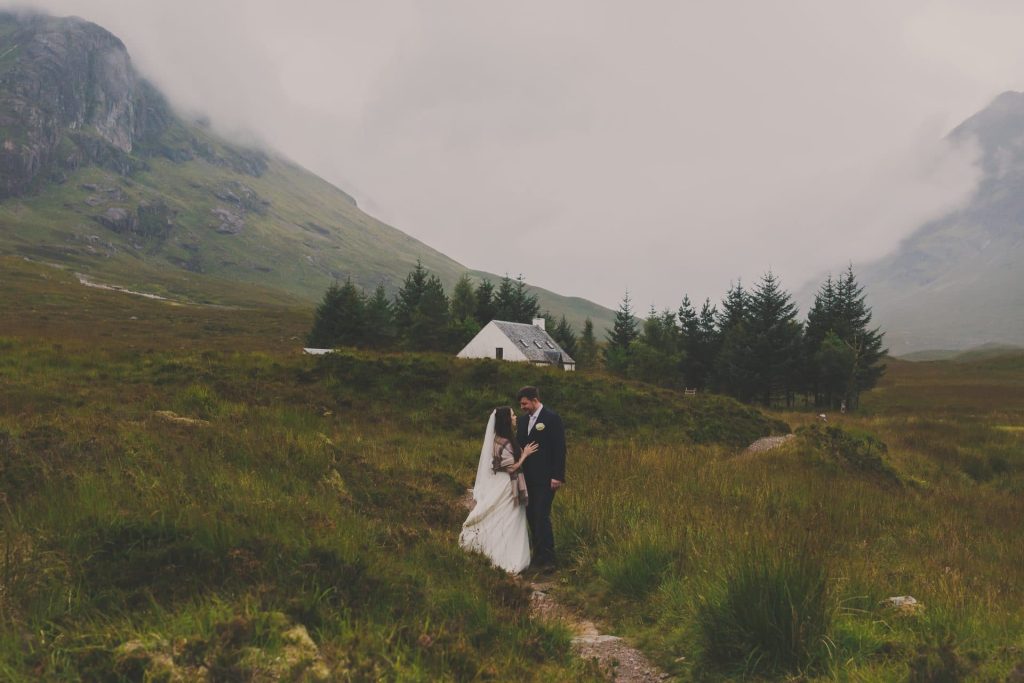 elopement in the hills with a house in the background